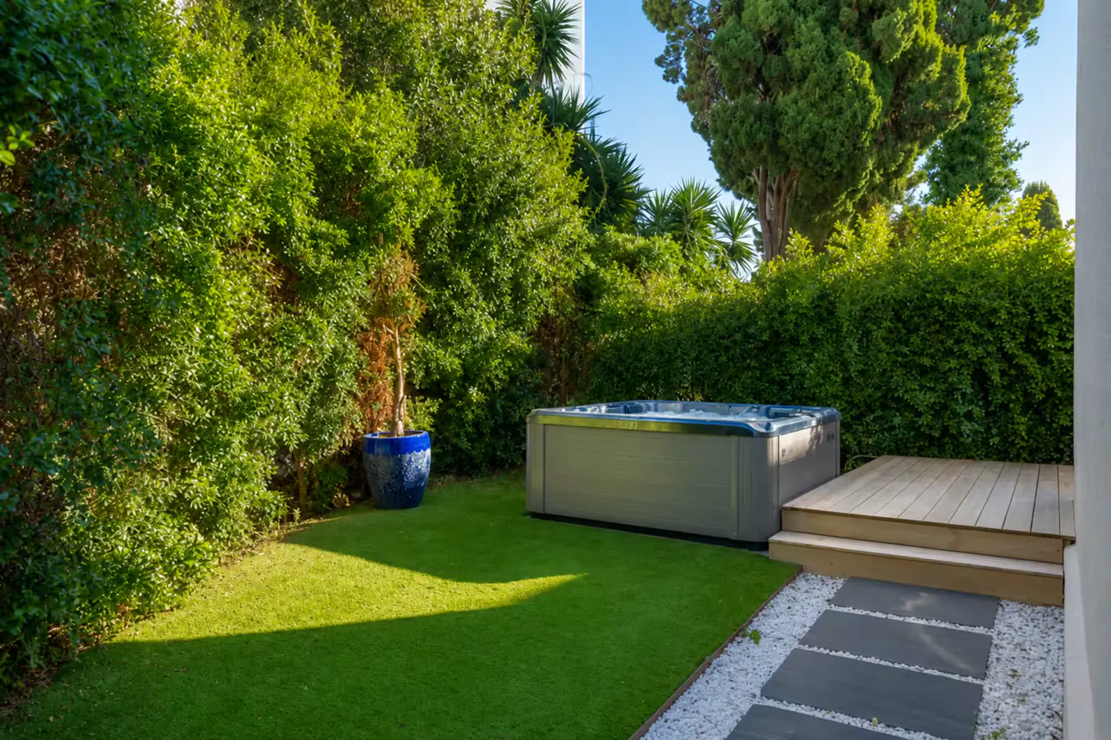 Jacuzzi tucked in the garden corner